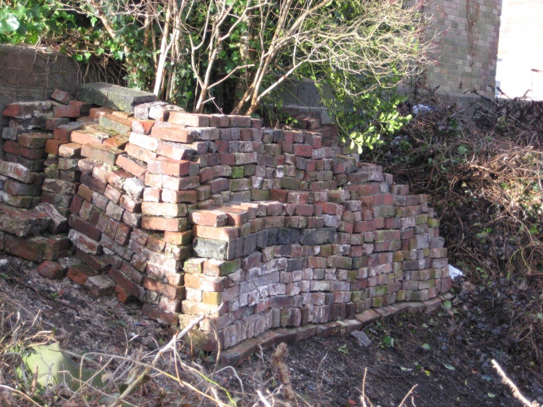 Abergavenny URC graveyard wall bricks stacked Jan 2009 006.jpg